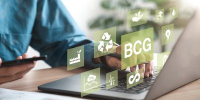 Businessman using computer to study BCG for sustainable economic development. BCG concept, bioeconomy, circular economy, green economy. with an icon on the screen